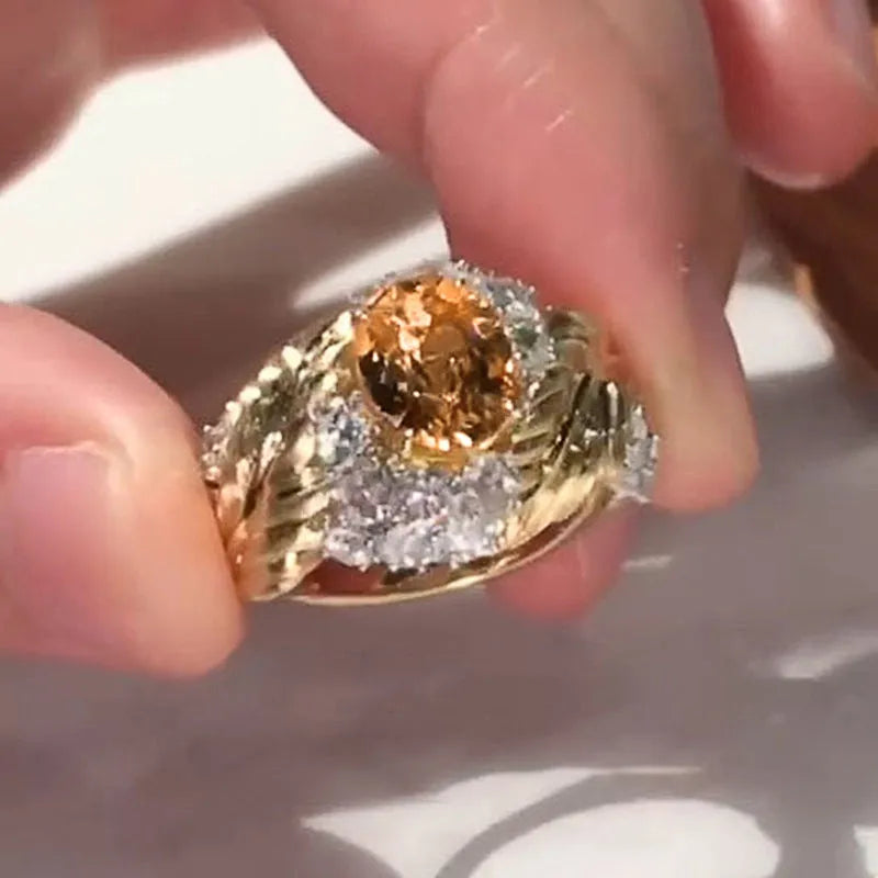 Gold colour feather embossed copper ring with yellow zircon stones in geometric design