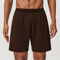 Man wearing sky blue double-layer quick-dry running shorts with a mid-waist fit.