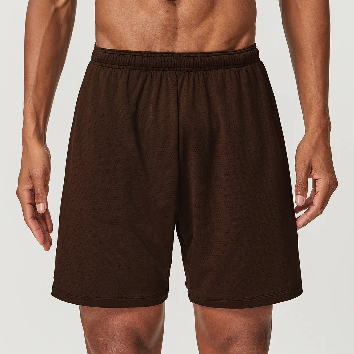 Man wearing sky blue double-layer quick-dry running shorts with a mid-waist fit.