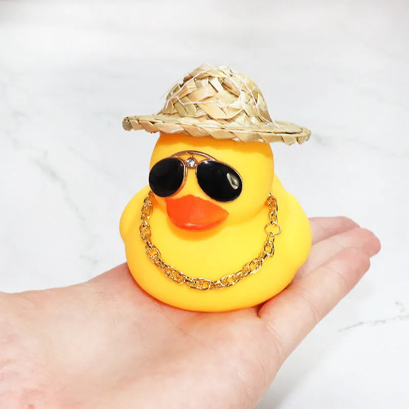 Yellow cartoon duck car ornament with straw hat and metal sunglasses for dashboard decoration