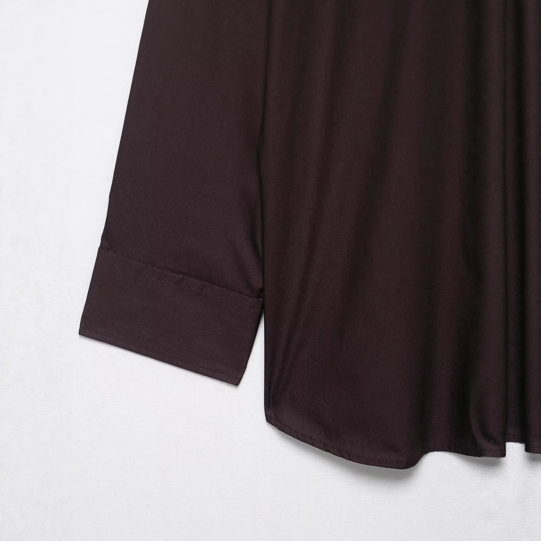 Brown women's poplin shirt with long sleeves, a loose fit, and a bow tie front closure.