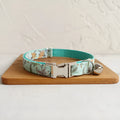 Green adjustable pet collar made from cloth and webbing, available in sizes L and S