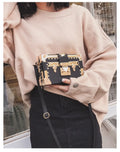 Hard structured women's shoulder bag in PU leather with single strap and flap design
