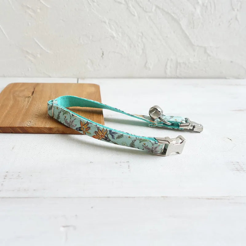 Green adjustable pet collar made from cloth and webbing, available in sizes L and S