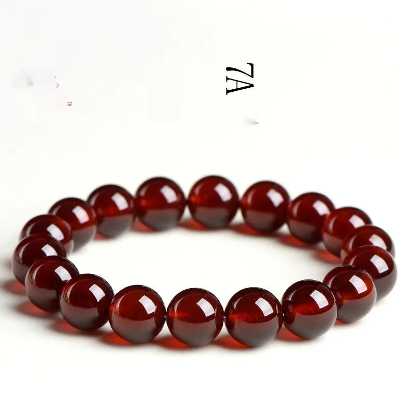Natural orange red garnet ball bracelet with spherical crystal beads and traditional Ruyi decorative element