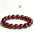 Natural orange red garnet ball bracelet with spherical crystal beads and traditional Ruyi decorative element