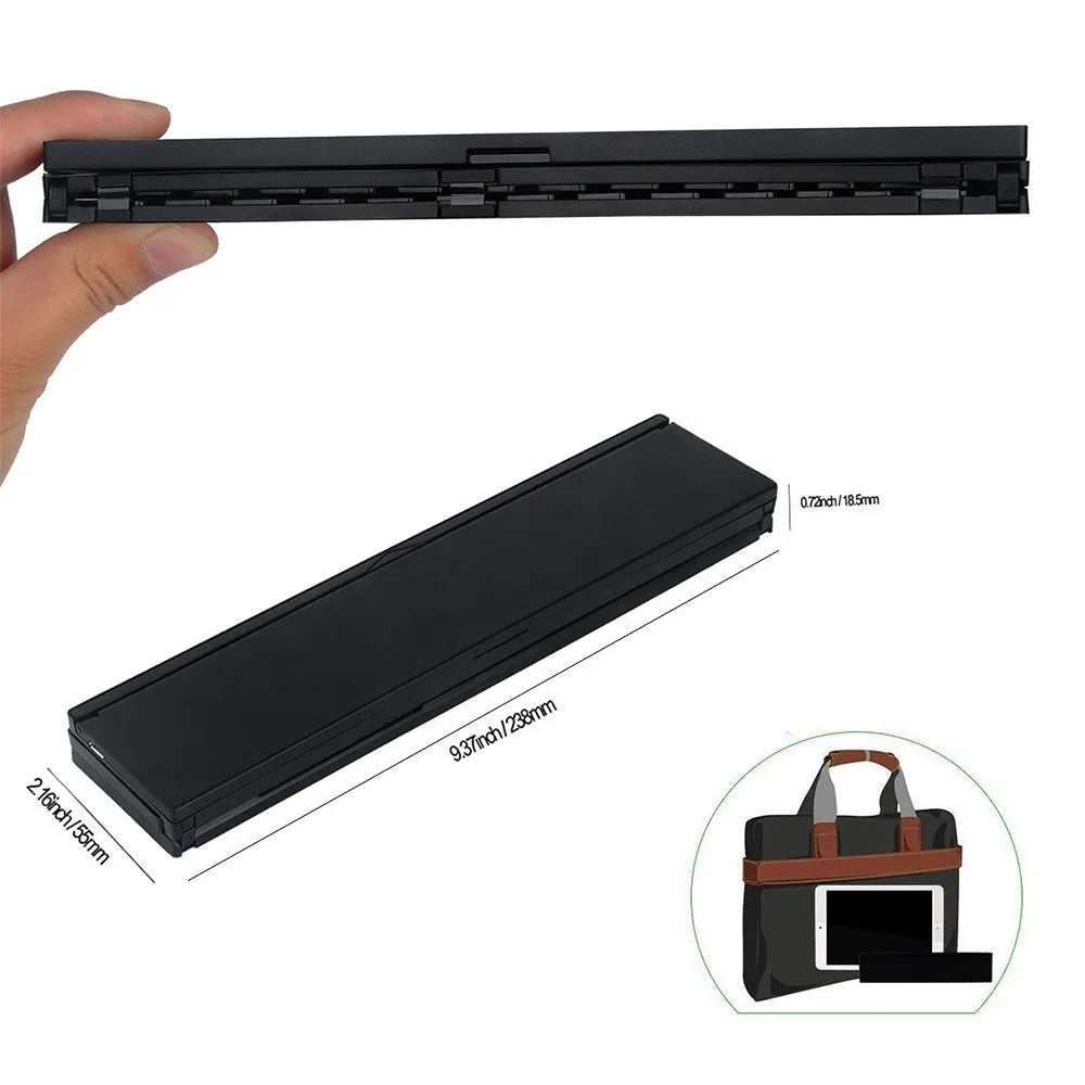 Black mini folding Bluetooth keyboard shown open next to a tablet, displaying its compact 5.8-inch size and aluminium bottom.