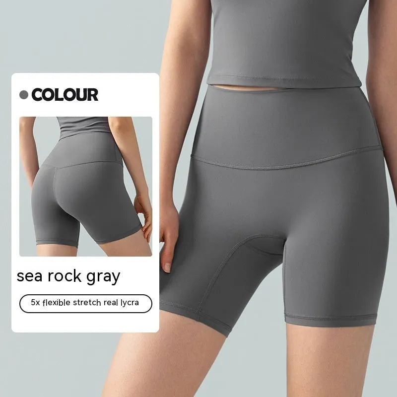Women's Lycra yoga tight shorts in leaf green colour showing high-waist design and four-point anti-exposure construction