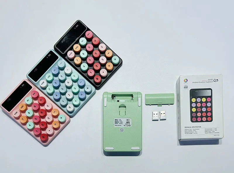 Q3 wireless digital keyboard in a macaron colour option on a desk.