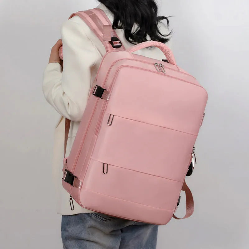Purple women's travel backpack with multiple compartments and air pillow belt system