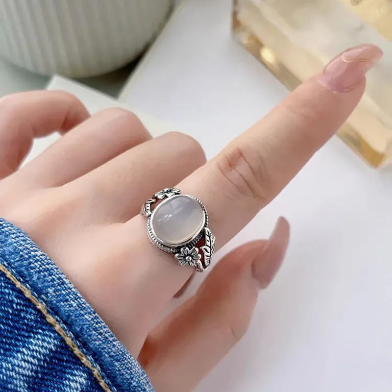 Adjustable open-mouth vintage ring in antiqued copper with a white chalcedony-style colour.