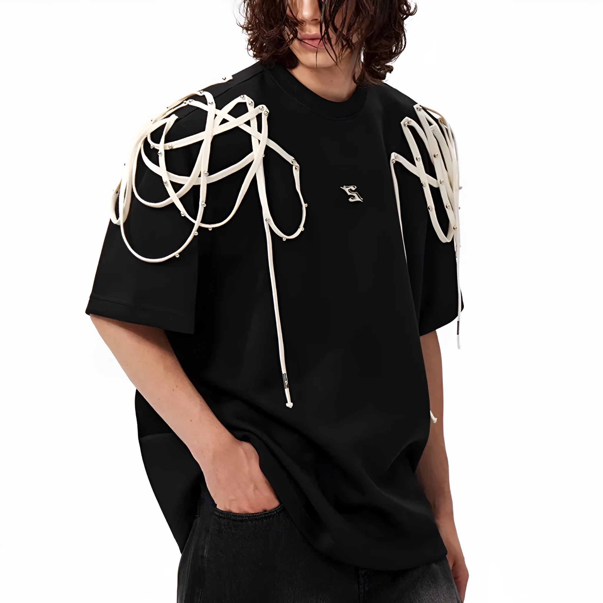 Black loose fit T-shirt with padded shoulders featuring decorative rivet detailing and ribbed texture