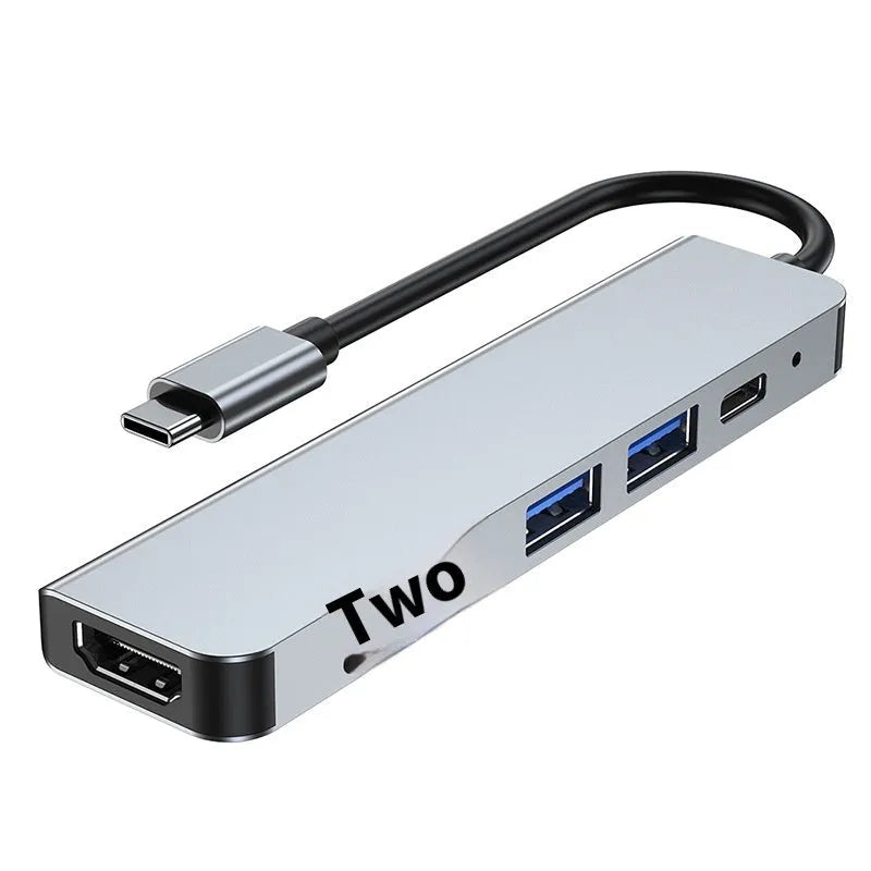 Portable USB-C expansion dock showing multiple ports including HDMI and USB connections