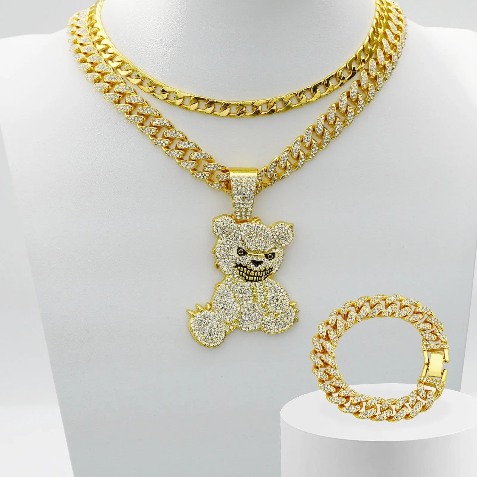 Gold three-piece jewellery set with rhinestone bear pendants on Cuban link chain necklaces and bracelet
