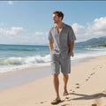 Linen leisure beach suit set featuring a short sleeve shirt and matching shorts in a light blue colour