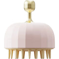 Green silicone double-sided pet bath massage brush with soft bristles on a bathroom counter.