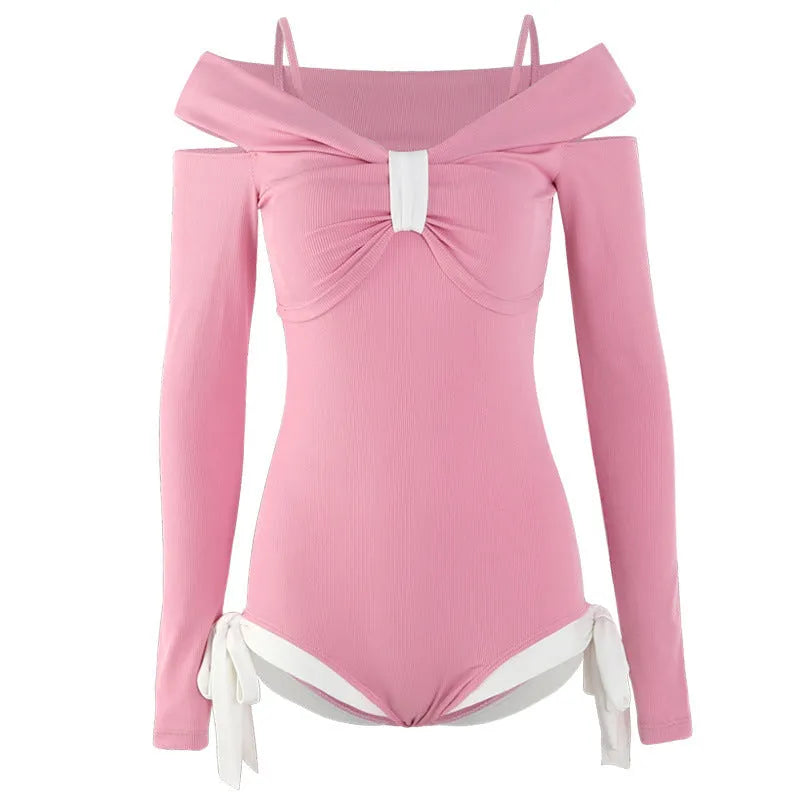 Women's long sleeve one-piece swimsuit in black or pink with polyester fibre construction