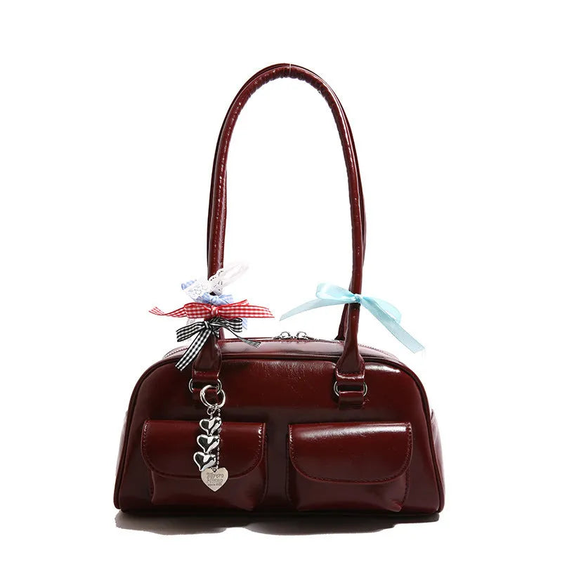 Retro PU leather pillow bag with one-shoulder design and double straps in black colour