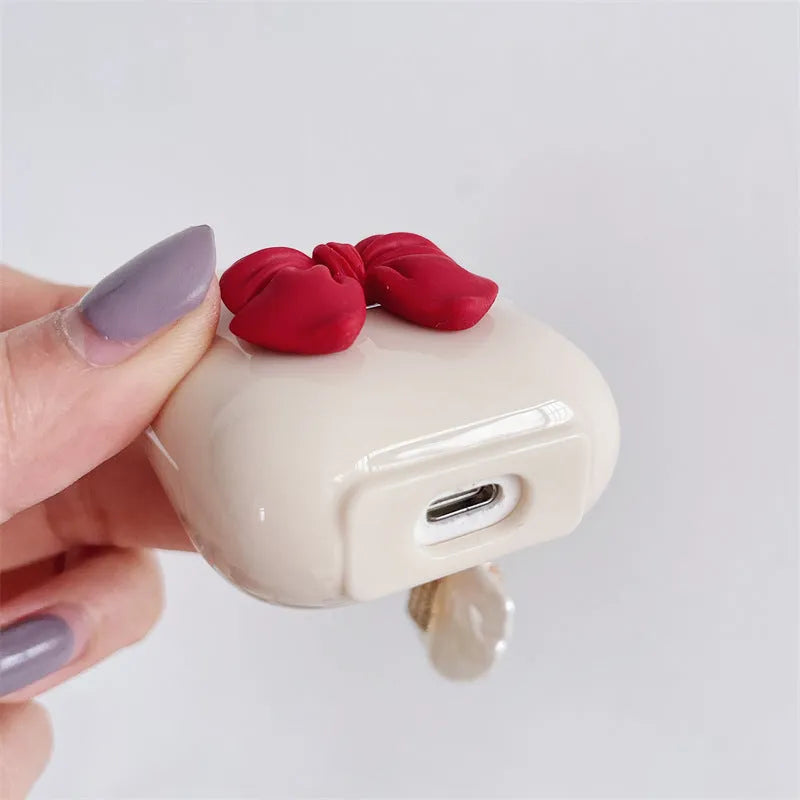 Beige red bow shell TPU AirPods case with clamshell design for AirPods Pro