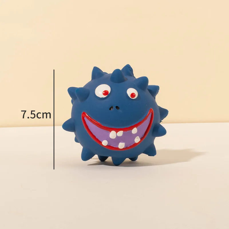 Set of four coloured squeaky dog balls with cute faces on a bumpy latex rubber surface.