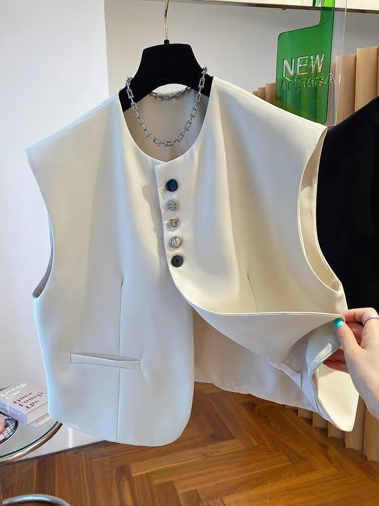Beige loose-fitting cropped waistcoat dress with side pockets on a model.
