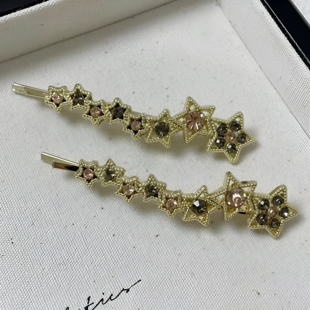 Korean style gold electroplated alloy hair barrette featuring a five-pointed star and word design.