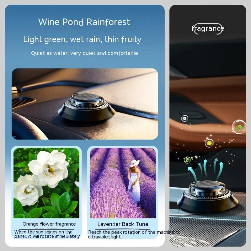 Solar-powered kinetic car air freshener with rotating double rings on a black dashboard.