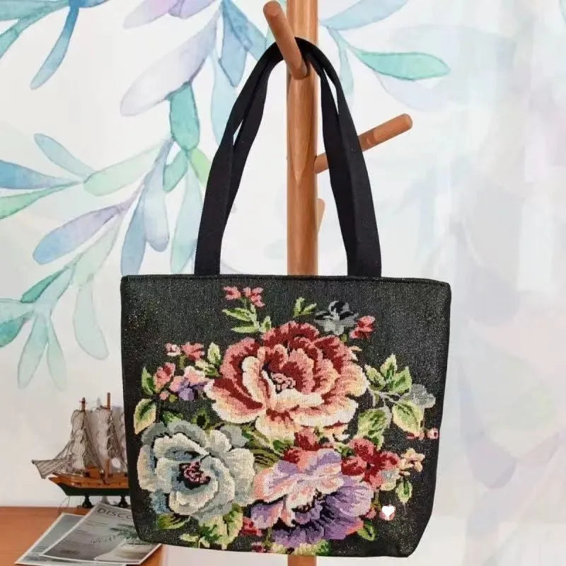 Double-sided embroidered canvas bag with gold wire detailing showing botanical pattern