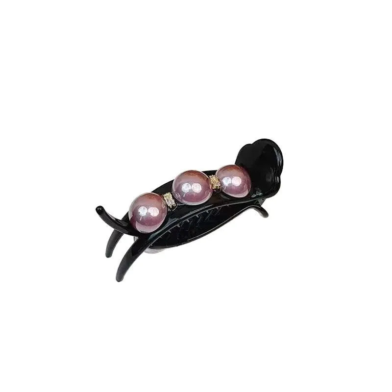 Acrylic pea barrette hair clip for women in green, shown against a dark background