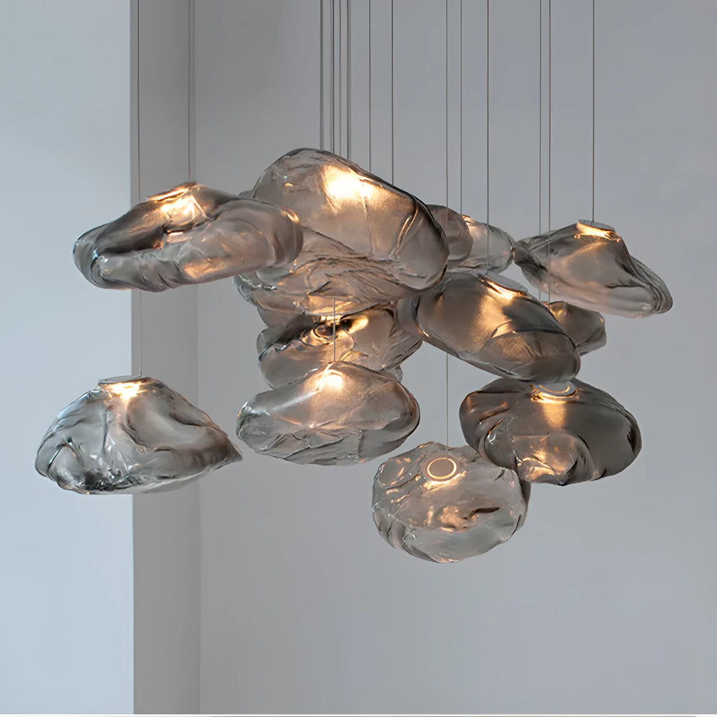 Modern fabric chandelier light with glass shade in amber, clear, or smoke grey, shown in small and large sizes.
