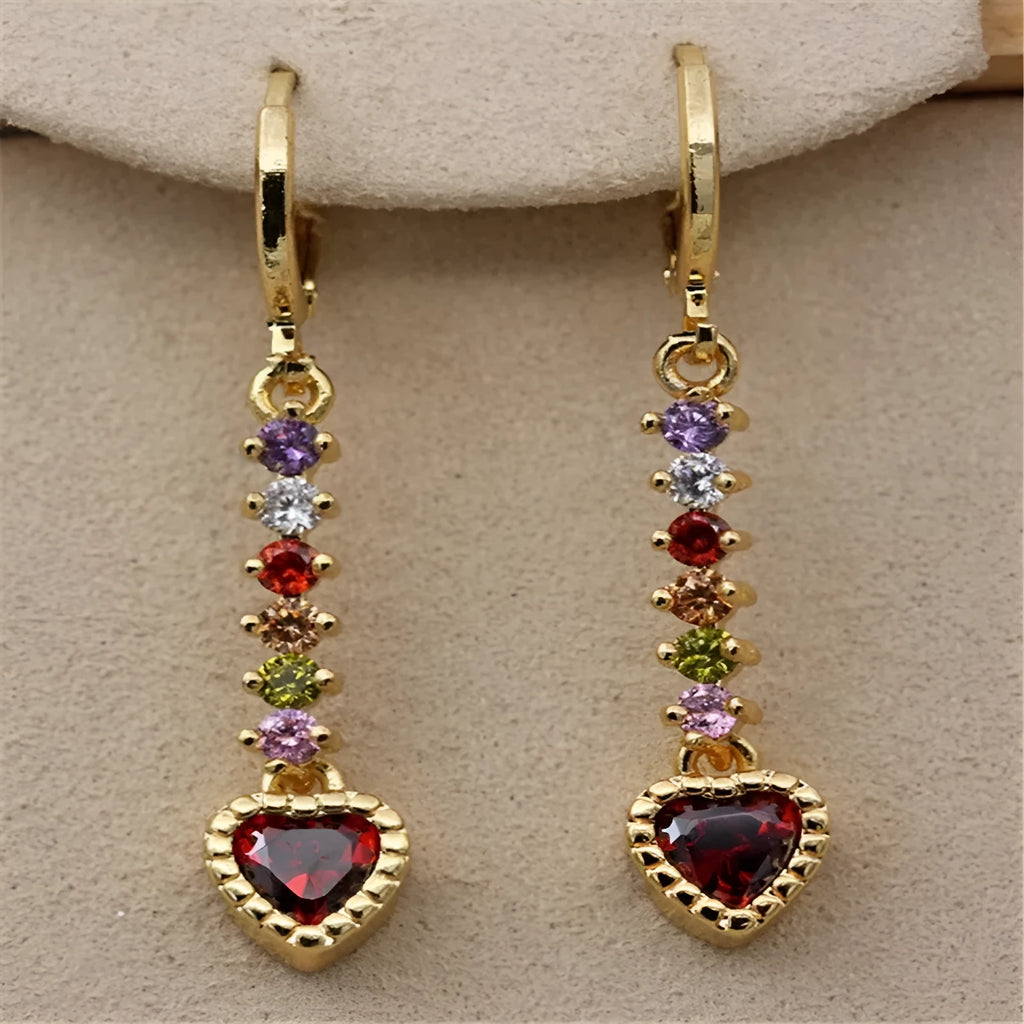 A pair of gold-coloured heart-shaped metal earrings for women.