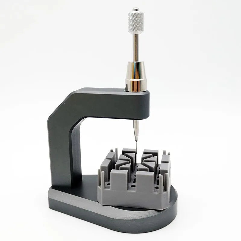 Silver tool steel press strap removal tool for watches, jewellery, and electronics.