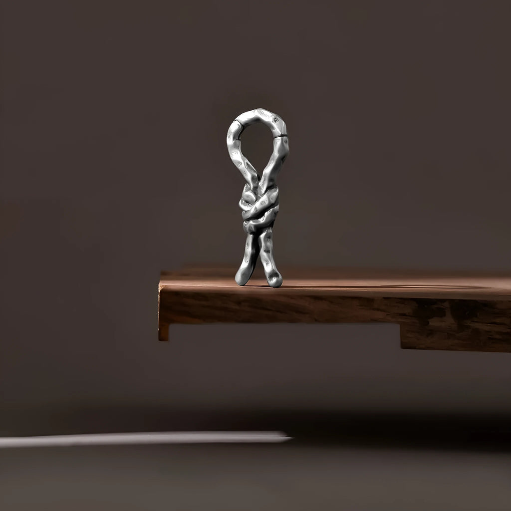 Close-up of 4mm copper bending and connecting earring for auricle piercing.