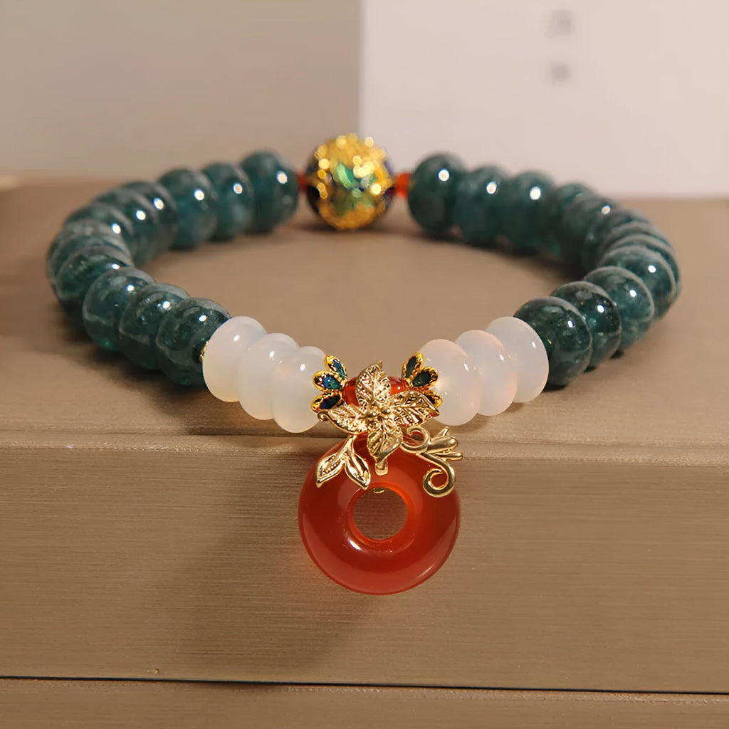 Women's blue water jade and red agate crystal bracelet with peace buckle closure