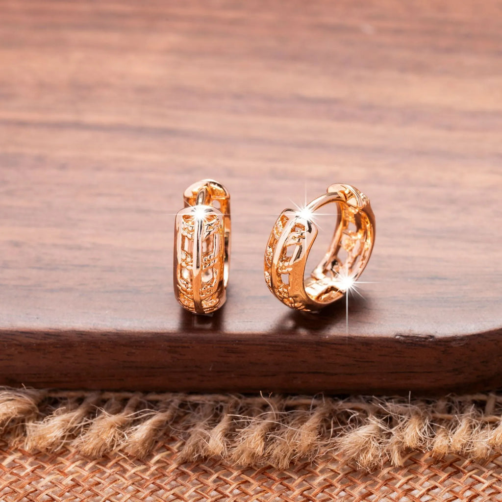 Small rose gold hollowed-out leaf and heart shaped copper earrings