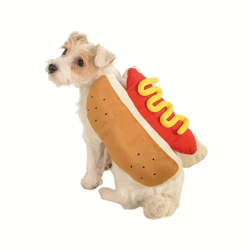 A small dog wearing a soft, stuffed hot dog costume in a winter setting.