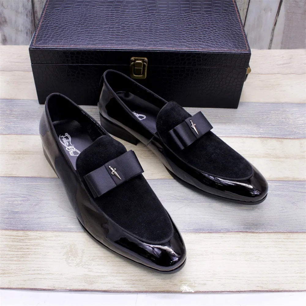 Men's low-top leather shoes in black with a tassel detail and glossy patent leather accents.