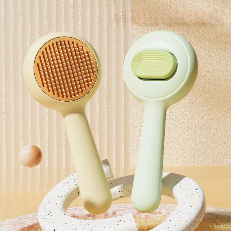 Green or yellow cat grooming brush with stainless steel comb teeth and a non-slip plastic handle.