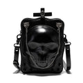 Black square crossbody bag with embossed skull design, chain accents, and zip opening