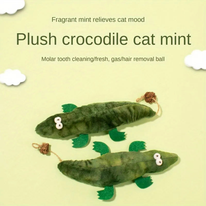 Green plush alligator cat toy with catnip filling and peppermint scent for oral cleansing.