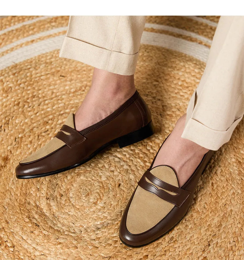 Coffee grey suede slip-on loafers with a rubber sole shown from the side.