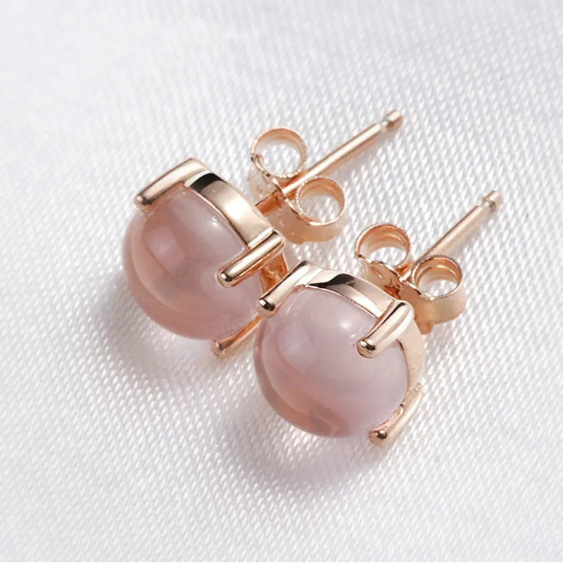 Rose gold drop shape stud earrings with synthetic quartz crystal inlay