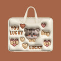 Inflatable PU leather laptop bag in a cartoon panda design with shoulder strap, shown hanging from a suitcase.