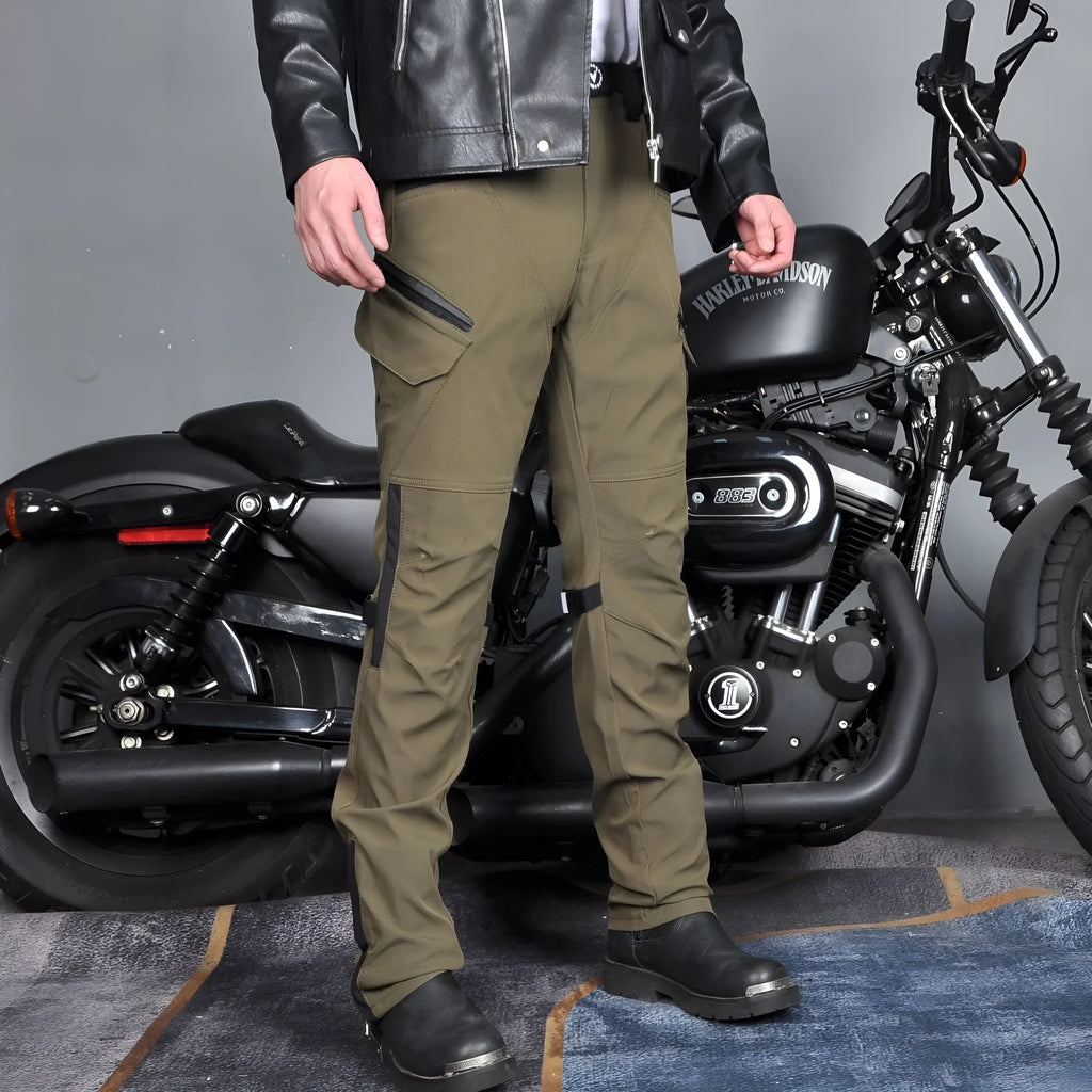 Man's black waterproof motorcycle cycling pants with adjustable belt laid flat.