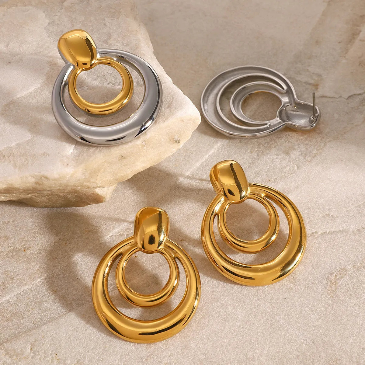 Golden round double layer hollow stud earrings with geometric design and electroplated finish