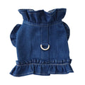 Blue denim dog dress with ruffle trim and back leash hook on a model dog