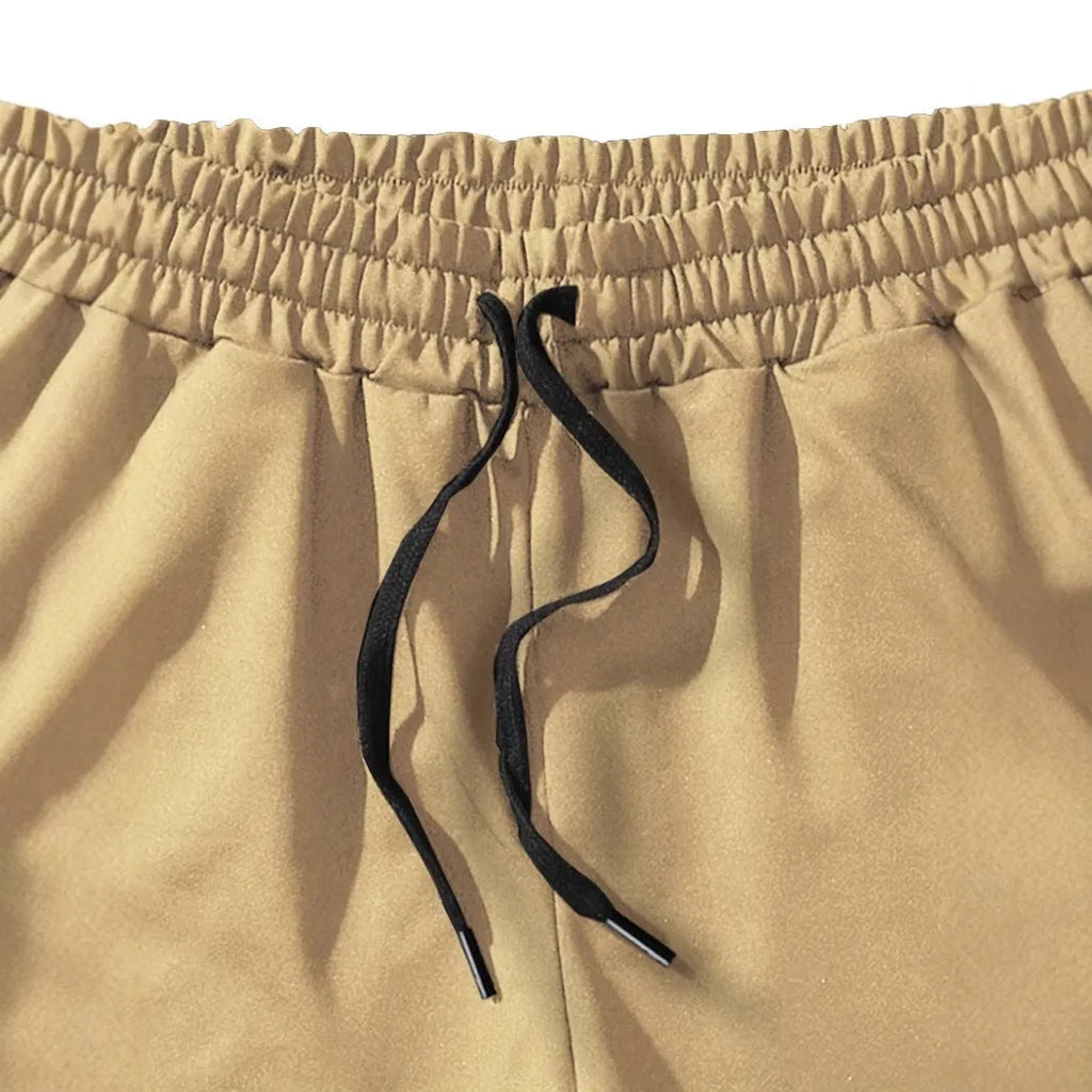 Men's khaki coconut print polyester sports shorts with straight cut and micro elasticity