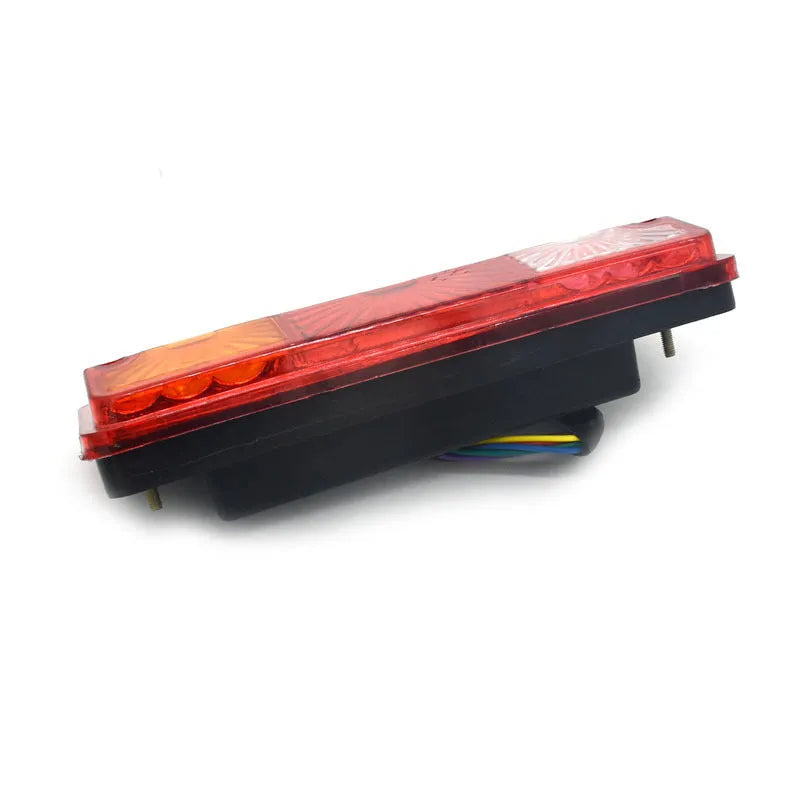 Black semi-closed taillight for electric tricycle, rear view showing housing.