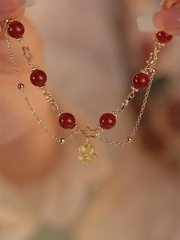 A red agate double layer bracelet with floral details for women.