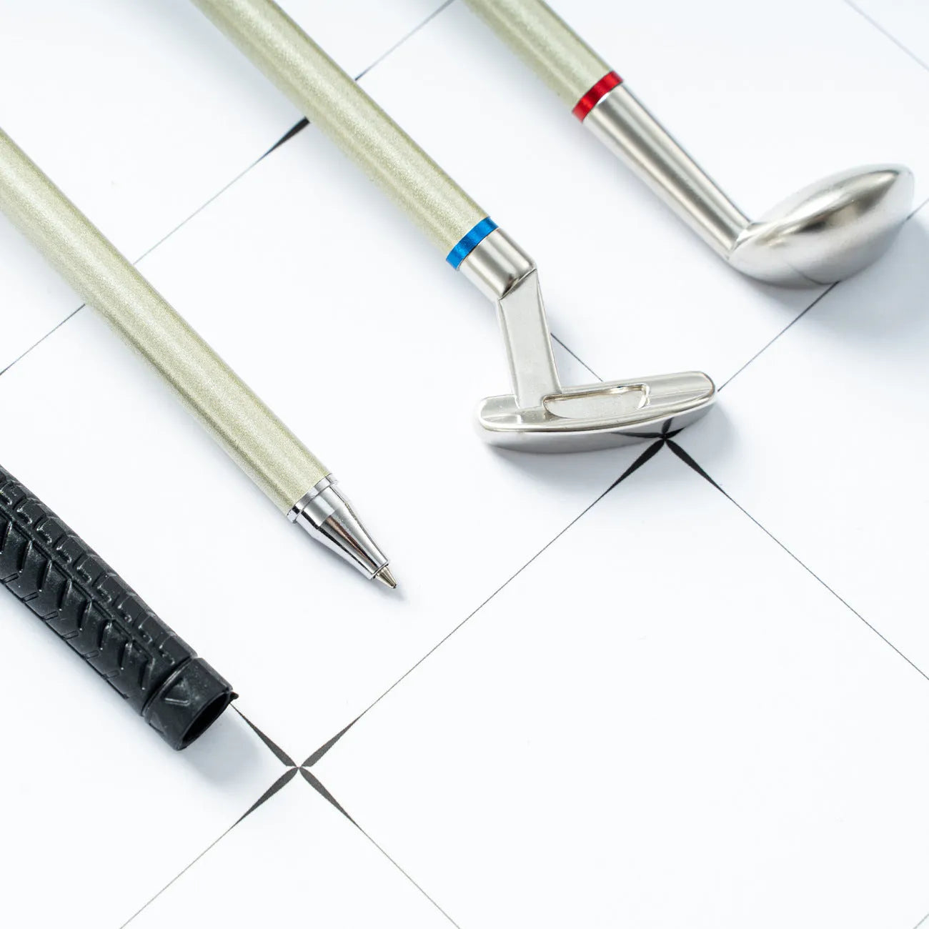 Three metal ballpoint pens with golf suit design showing 0.7mm bullet-type pen heads